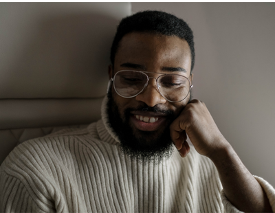 man smiling to himself alone single