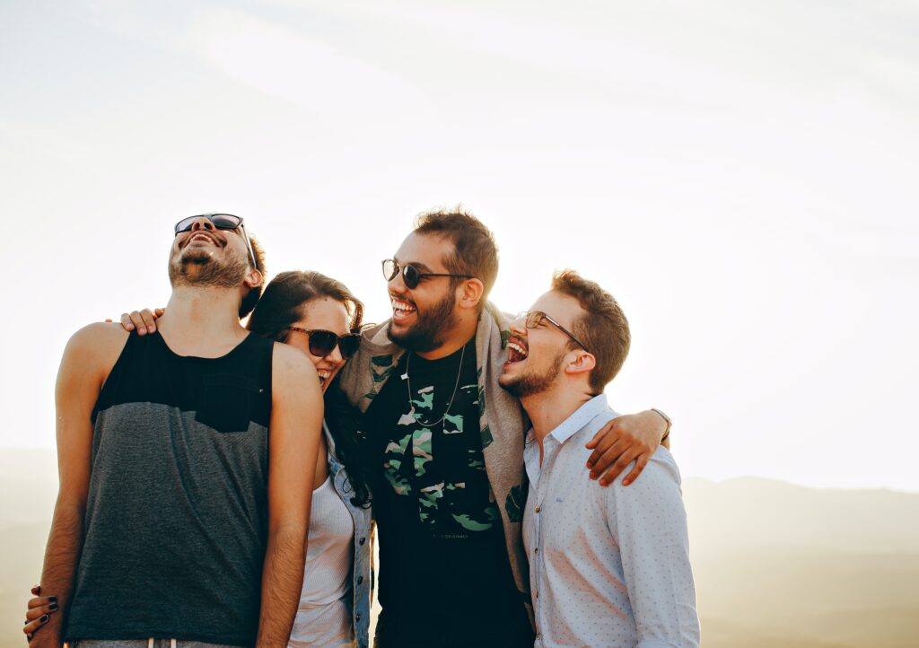 group of men laughing joking fun