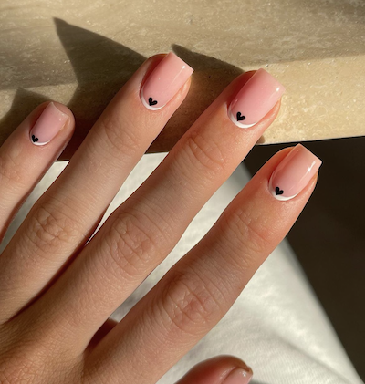 Nude with mini black hearts