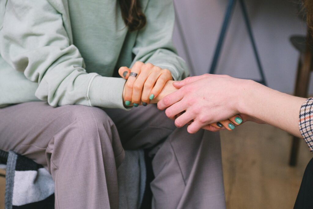 holding hands support grief loss
