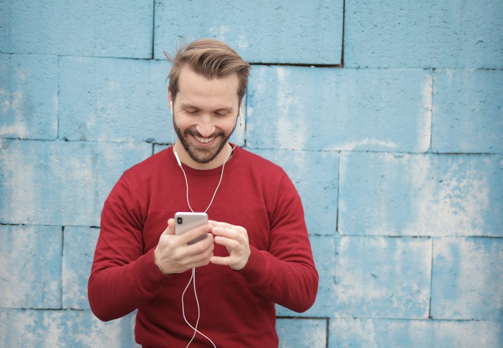 man looking at phone receiving text flirting